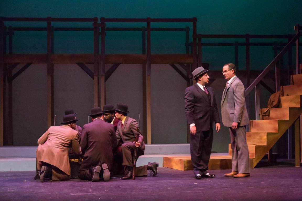 David Kincannon and Jeremy Rill (right) have a heated discussion as Coalhouse Walker's men (left) discuss their next steps.